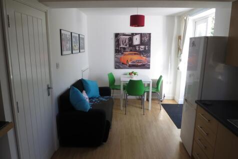 A bright and inviting living room with a comfor...