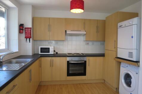 A modern and tidy kitchenette featuring essenti...