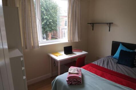 Bright, neatly presented bedroom with a comfort...