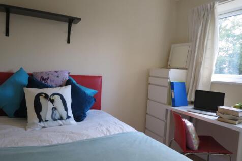 Bright, tidy bedroom with a comfortable bed dre...