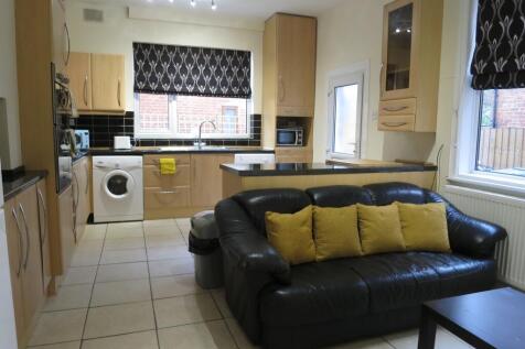 Bright open-plan living area with a modern fitt...