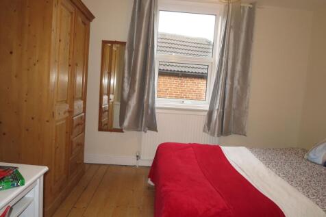 Bright, neatly presented bedroom with wooden fl...