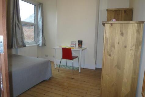 Bright, neatly presented bedroom with wooden fl...