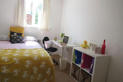 Bright, neatly presented bedroom with a comfort...