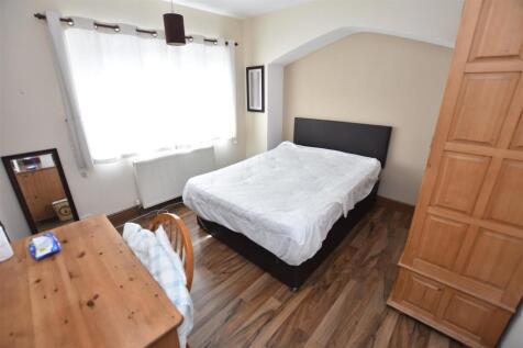 Bright, neatly presented bedroom with a comfort...