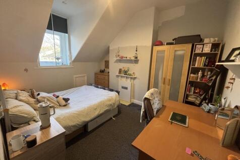 Bright, neatly presented bedroom with a double ...