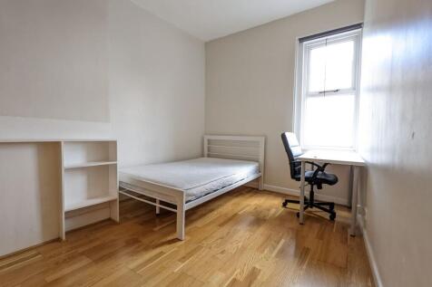 Bright, simply furnished single bedroom with wo...