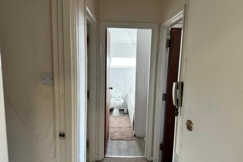 A tidy bathroom featuring essential amenities, ...