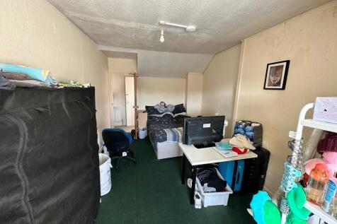 A spacious and inviting double bedroom with amp...