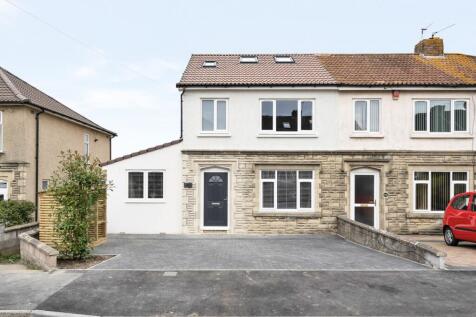 The front view of a well-maintained property wi...