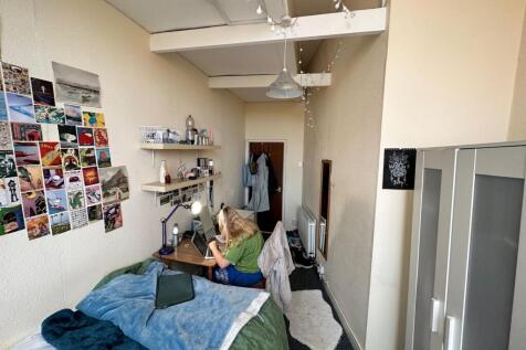 A cozy and stylish double bedroom, perfect for ...