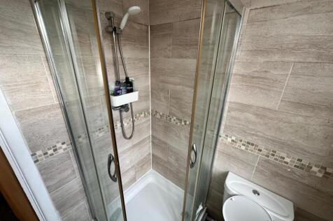 A clean and modern bathroom featuring a spaciou...