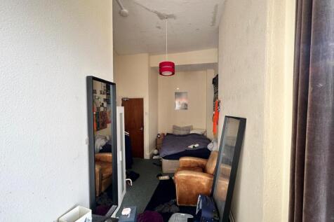 A cozy double bedroom with natural light, ideal...