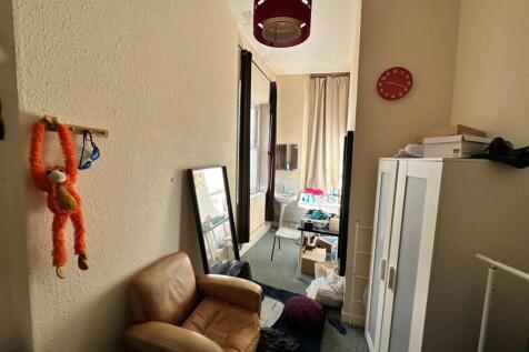 A cozy hallway with natural light and a welcomi...