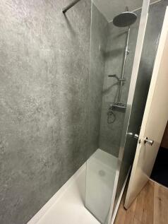 Contemporary shower with a large rainfall showe...