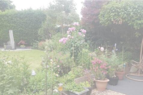 A beautifully landscaped garden filled with vib...