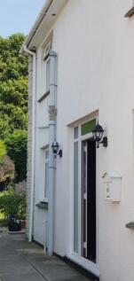 A welcoming entrance to the property with a bri...