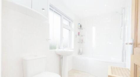 A bright and clean bathroom featuring a modern ...
