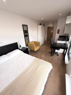 Bright, modern double bedroom with a comfortabl...
