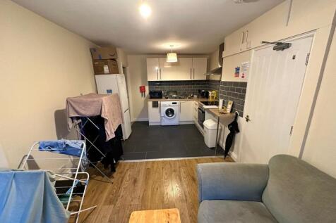 A cozy kitchenette area with modern appliances,...