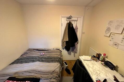 A cozy and well-organized double bedroom, perfe...