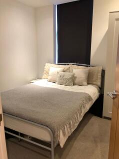 Neatly presented double bedroom with a cozy dou...