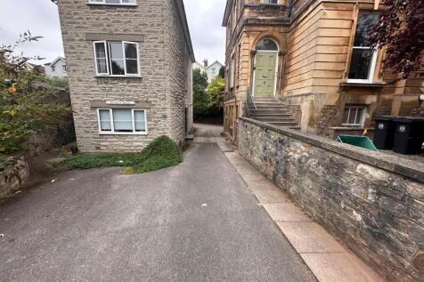 Stone-fronted period building with a raised ent...