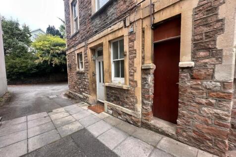 Stone-fronted property entrance set on a quiet ...