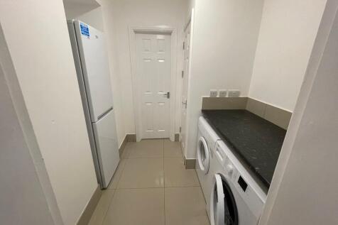 Bright, modern utility area with fitted counter...