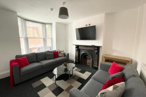 Bright, modern living room with two comfortable...