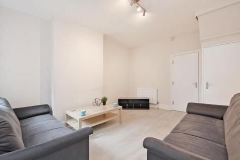 Bright, neutral living room with matching sofas...