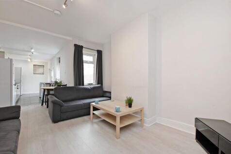 Bright, modern open-plan living area with neutr...