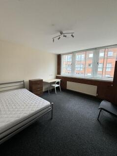 Bright, well-presented bedroom with a large win...