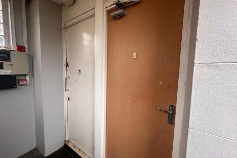 Internal entry hallway with two adjacent doors,...