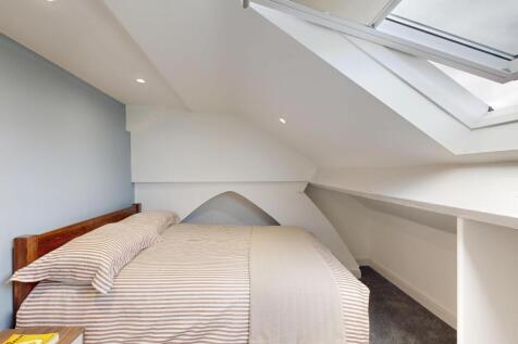 Bright and spacious master bedroom with ample n...