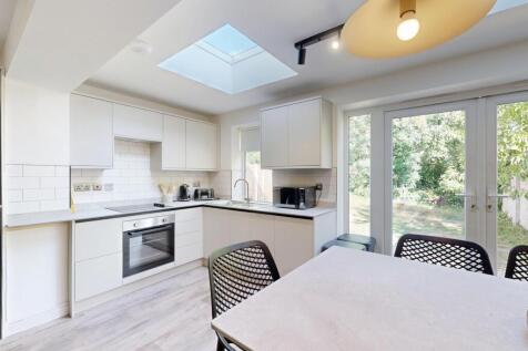 Bright and modern kitchen with ample natural li...