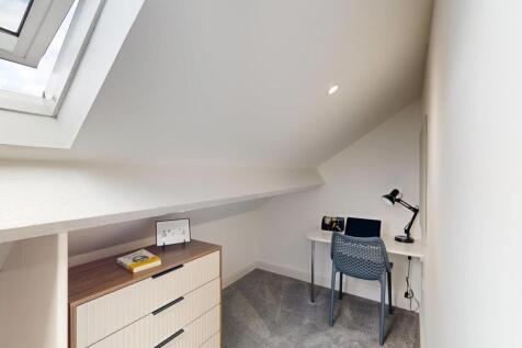Bright and tidy study nook with a desk, chair, ...