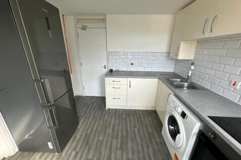 A modern and clean kitchen featuring ample coun...