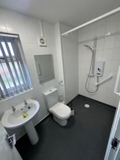 Bright and modern bathroom featuring a spacious...