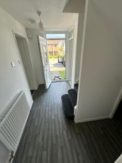 Bright and clean hallway featuring modern grey ...