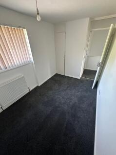 A neat and well-maintained small room with clea...