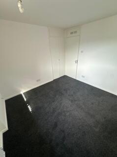 A clean and simple room with fresh white walls ...