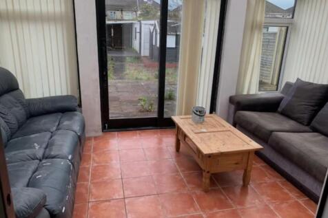 A spacious and inviting modern living room with...