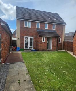 Neat private rear garden with a level lawn, pat...