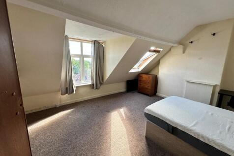 Bright attic double bedroom with dormer and sky...