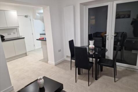 Modern open-plan living and dining area with a ...