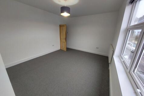 Bright, freshly painted double bedroom with a l...