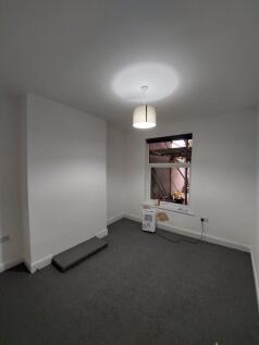 Freshly painted single bedroom with neutral car...