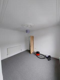 Bright, freshly redecorated bedroom with neutra...