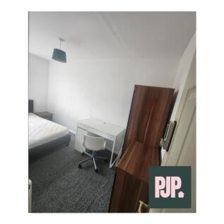 A bright and inviting double bedroom featuring ...